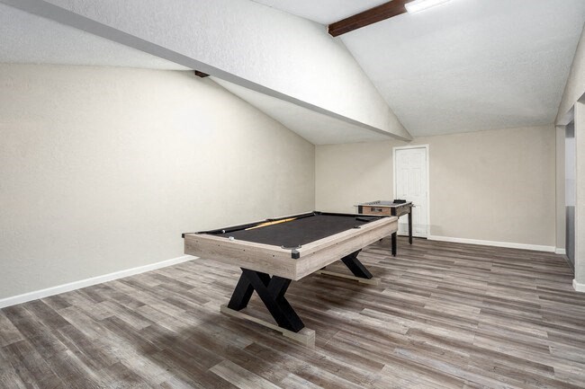 a billiards table in a game room in a house