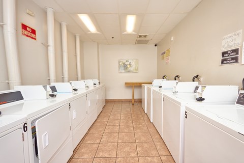 A laundromat with a "No Smoking" sign on the wall.