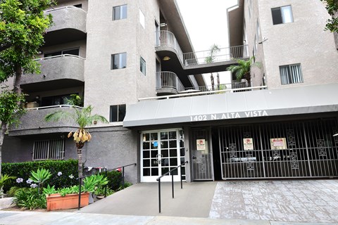 The image shows a building with the address 1402 N. Alta Vista.