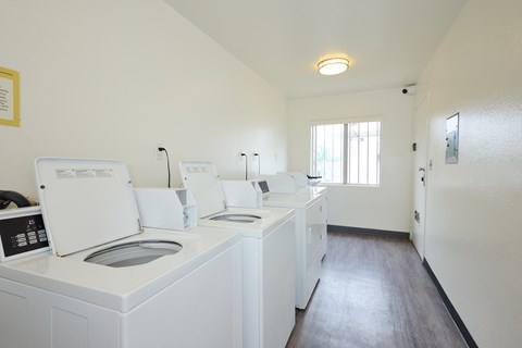 A laundry room with a washer and dryer.