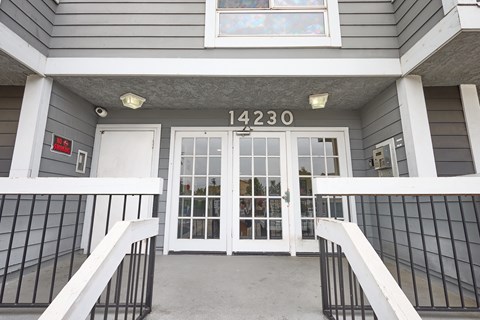 The front door of a building with the number 14230 on it.
