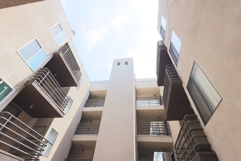 A view of a building looking up at the sky.