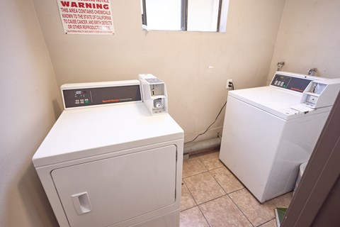 A laundry room with a washer and dryer.