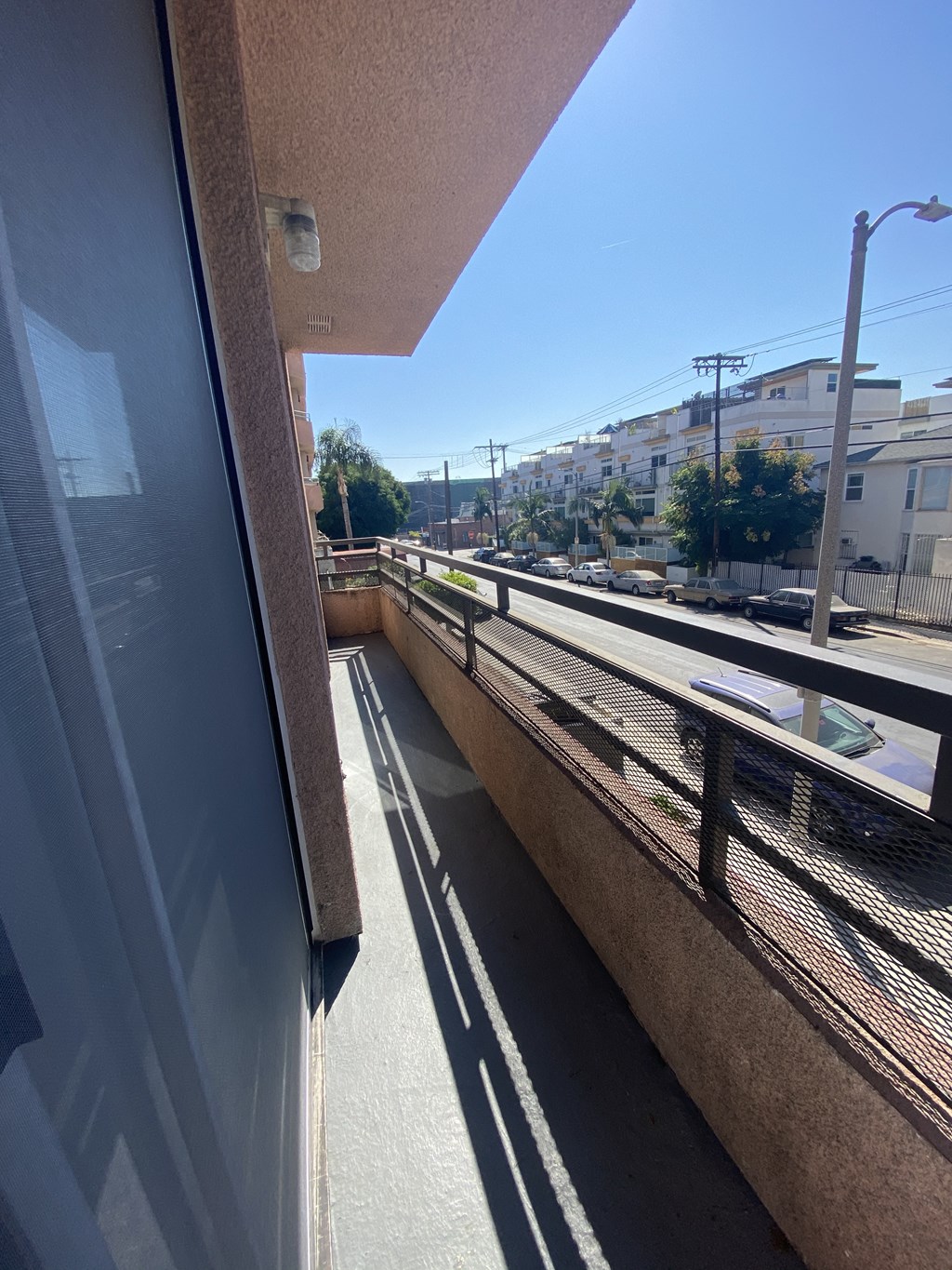 a balcony with a view of the train tracks