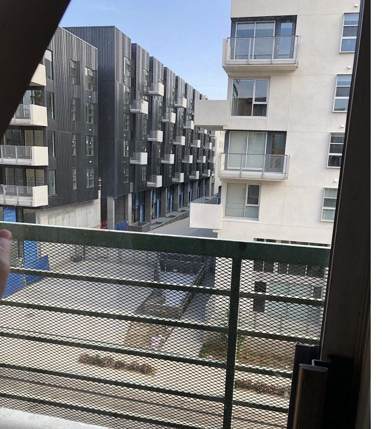 the view from a window of an apartment building