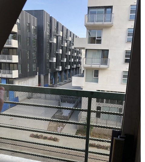 the view from a window of an apartment building