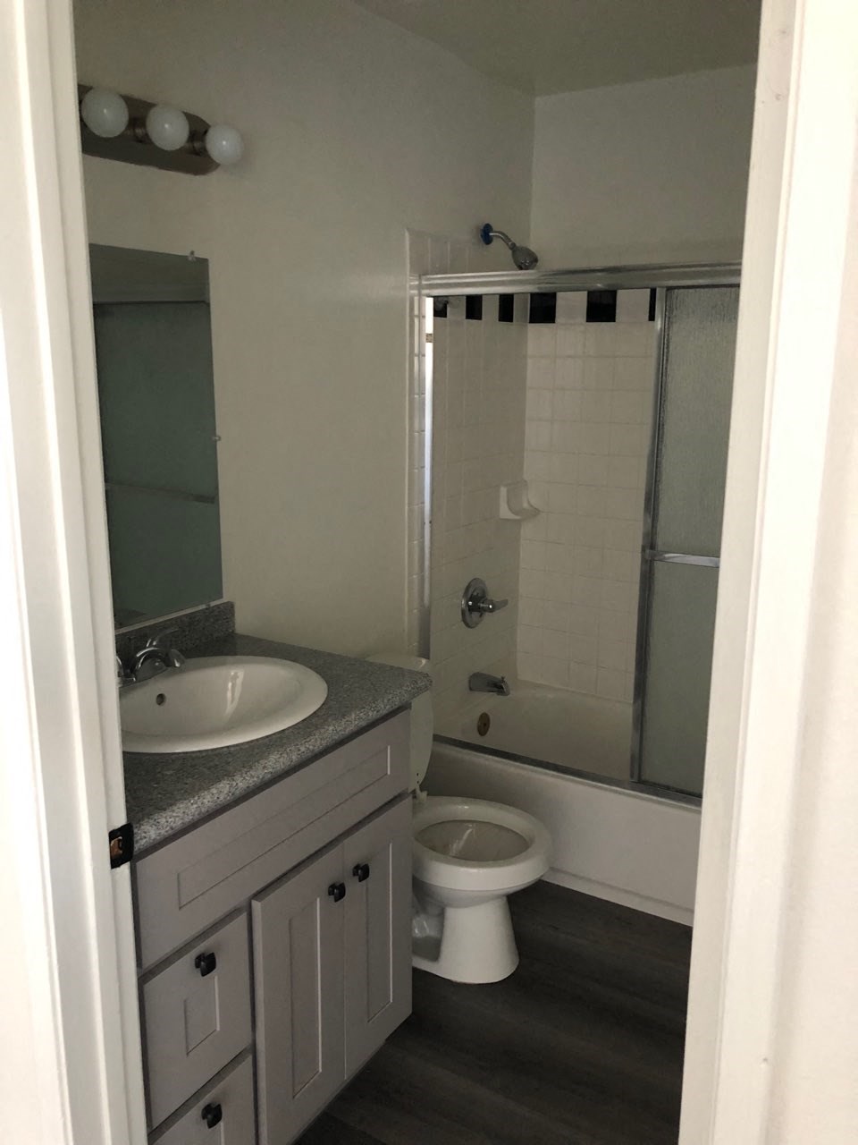 a small bathroom with a sink toilet and shower