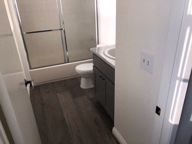 a bathroom with a sink toilet and a shower