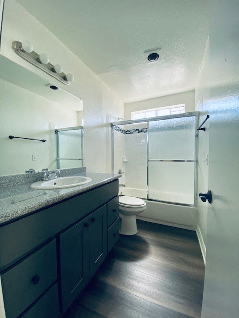 a bathroom with a sink and a toilet and a shower