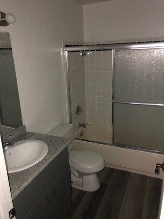 a bathroom with a sink toilet and a shower