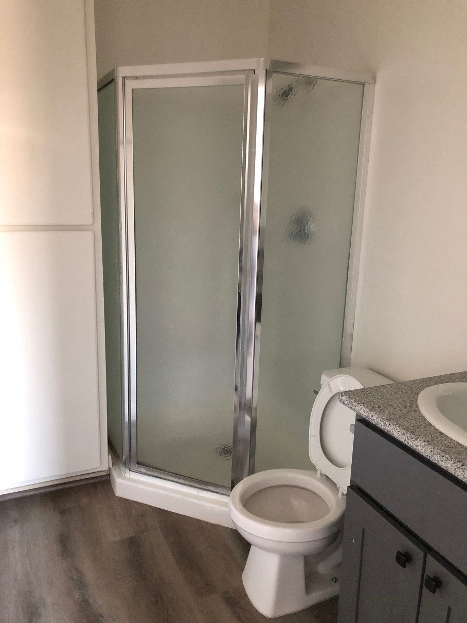 a small bathroom with a toilet and a shower
