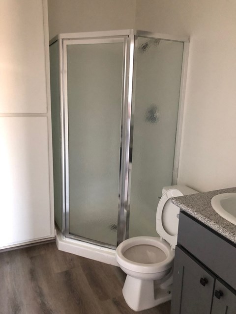 a small bathroom with a toilet and a shower