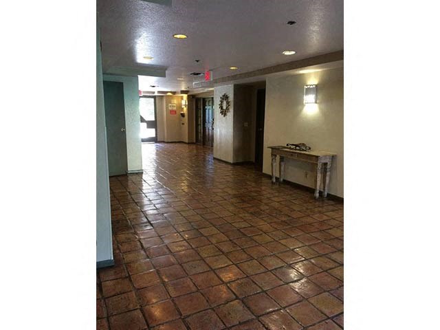 a large room with a table in the middle of it