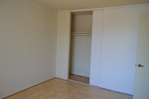 an empty room with a closet in it