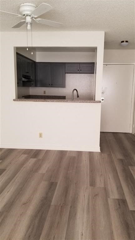 a kitchen with a counter in a empty room