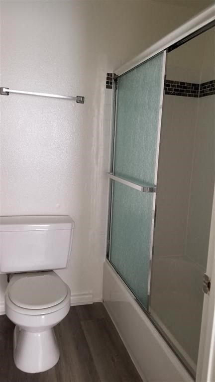 a small bathroom with a toilet and a shower