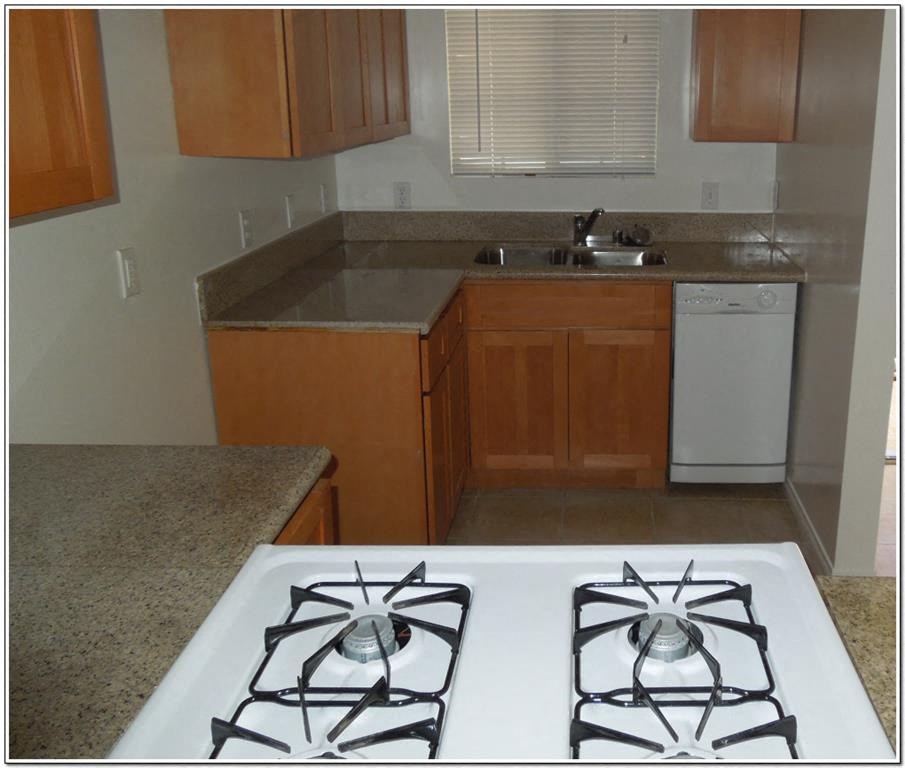 a kitchen with a stove and a sink
