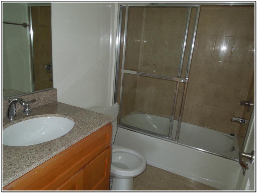 a bathroom with a sink toilet and a shower