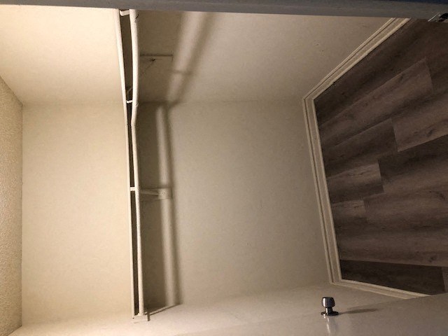 a bathroom with a mirror on the wall