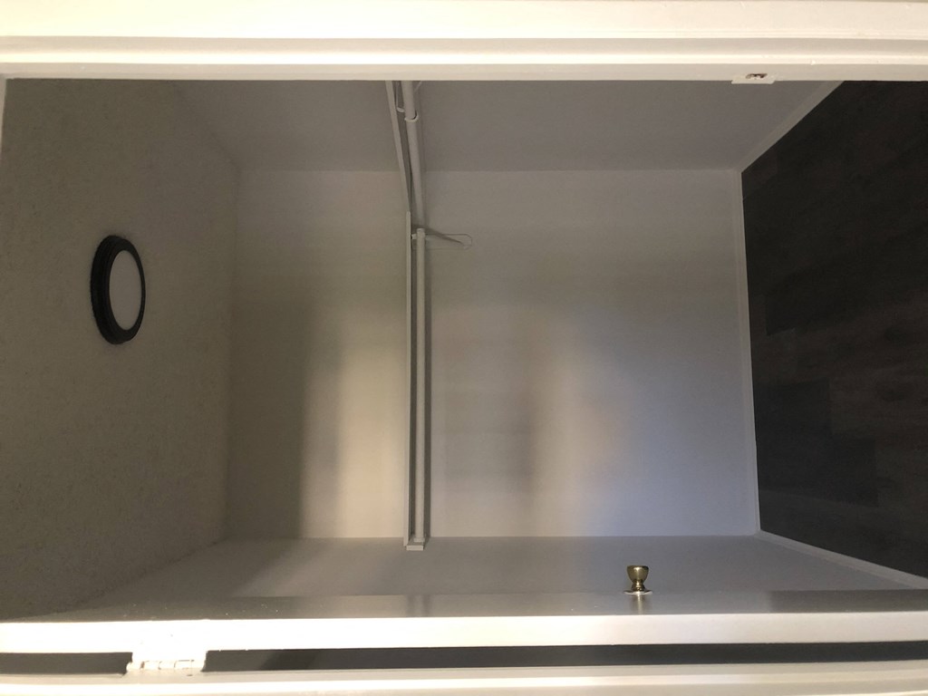 a glass display case with a shower in it