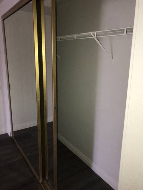 a closet with a sliding glass door