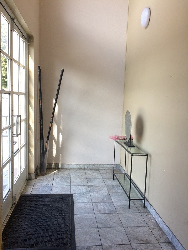 an empty room with a table and a window