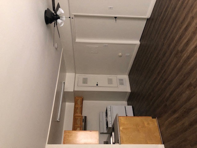 an overhead view of a kitchen with a stove and a ceiling fan