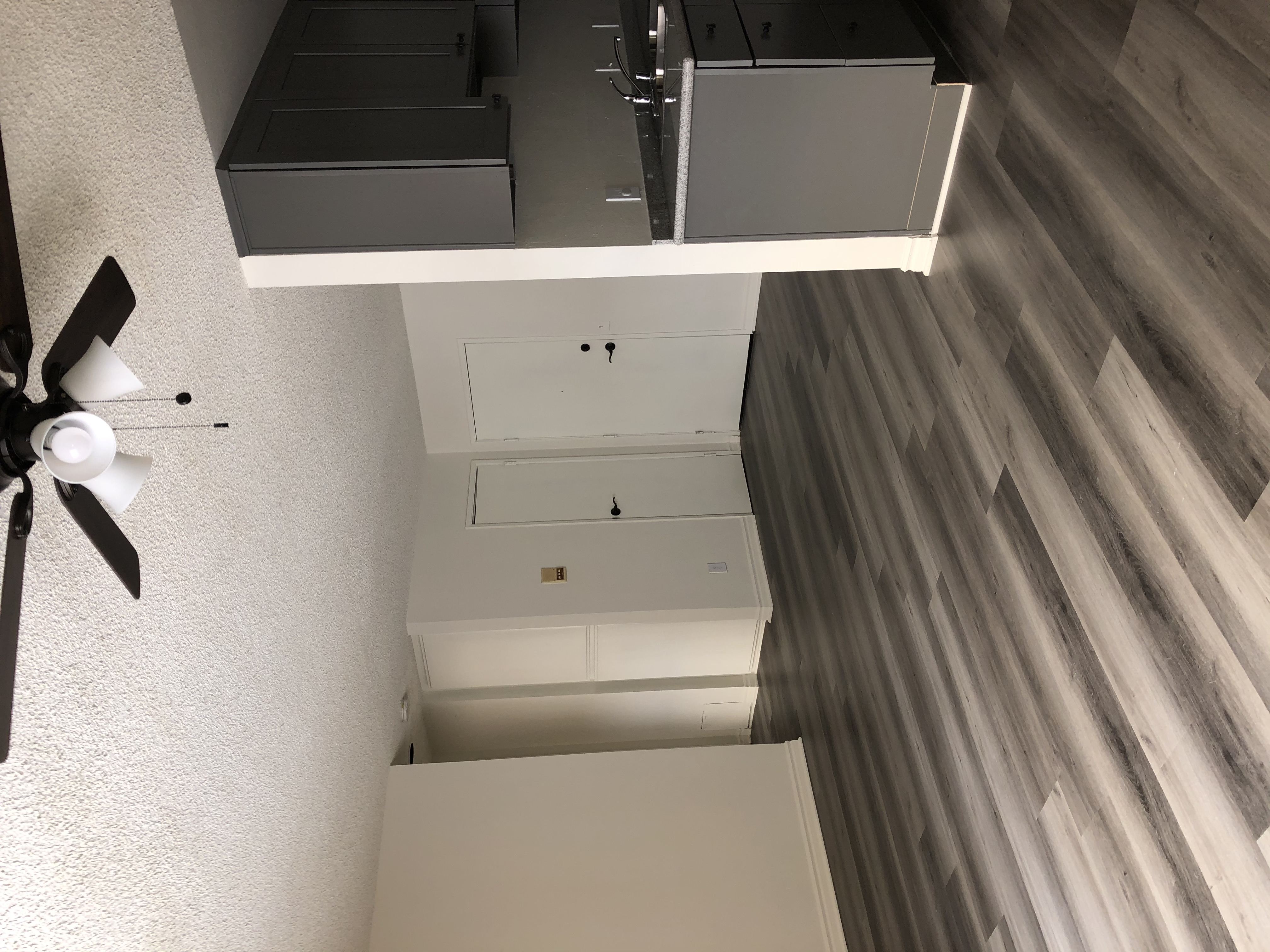 A ceiling fan hangs over a kitchen counter.