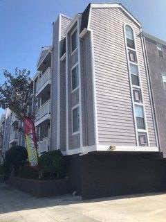 a tall building with a red sign in front of it