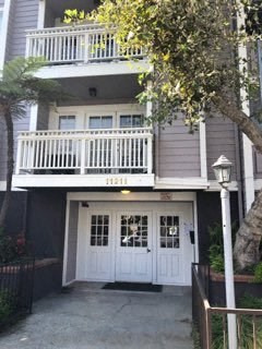 a house with a balcony on top of it