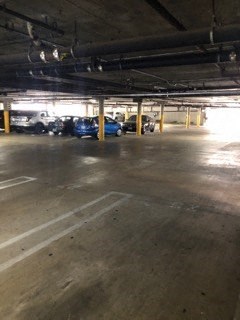 a parking garage with cars parked in it