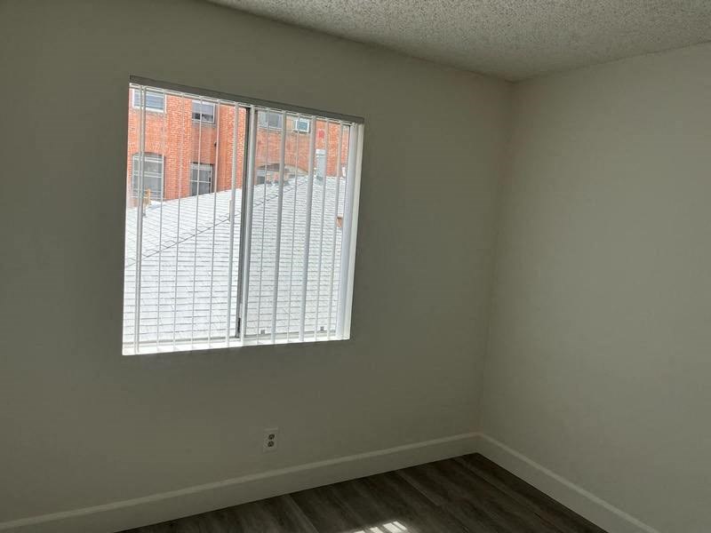 an empty room with a large window