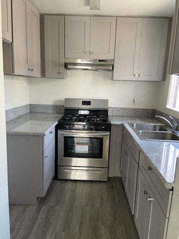 a kitchen with a stove and a sink