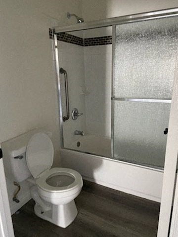 a small bathroom with a toilet and a shower