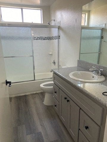 a bathroom with a sink toilet and a shower