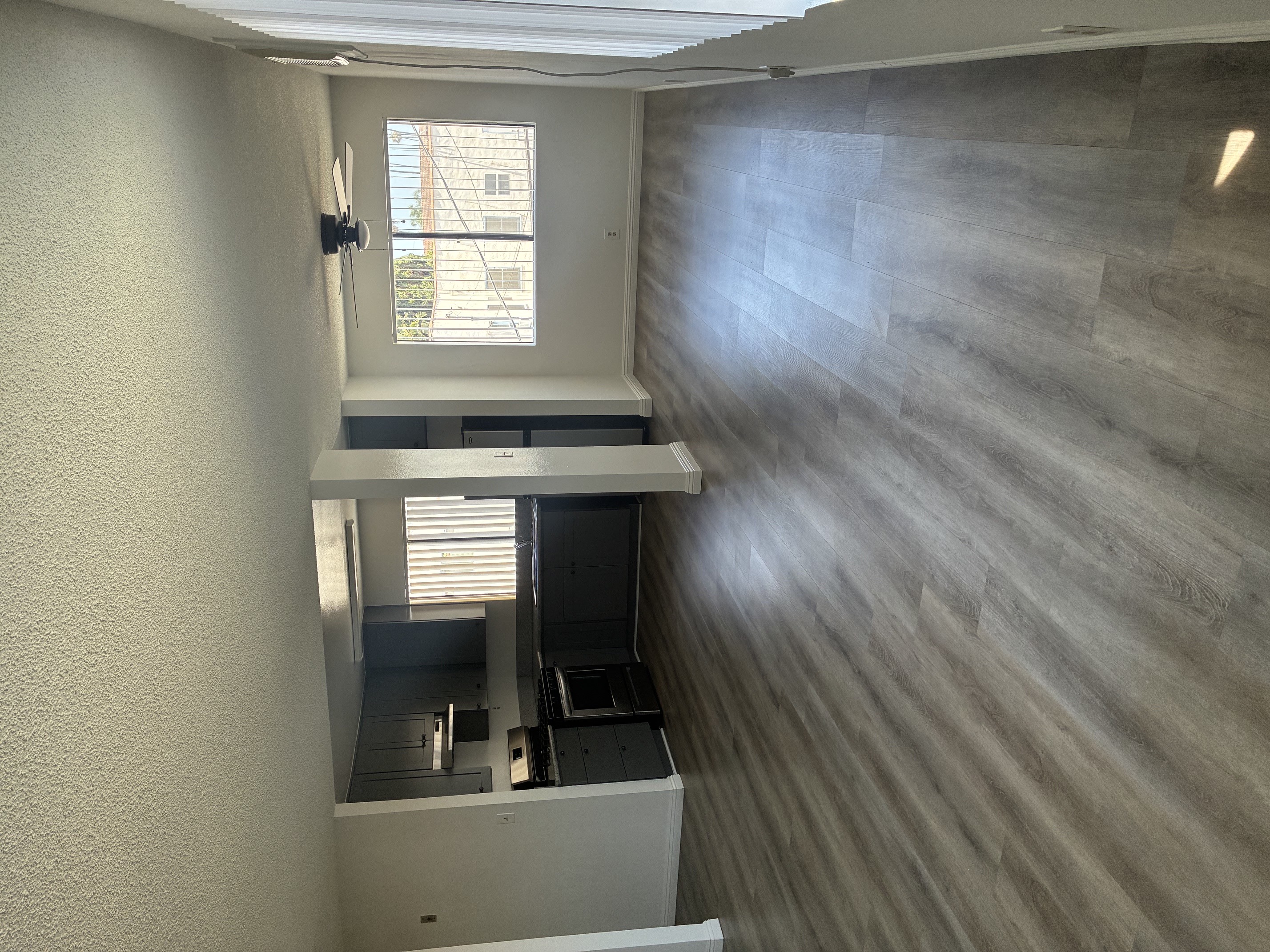 A kitchen with a window and a countertop.