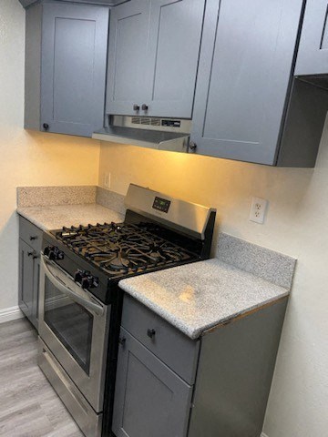 a kitchen with a stove and a counter top