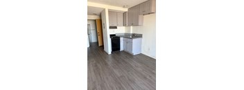 A kitchen with a black oven and a sink.