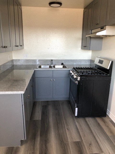 a small kitchen with a stove and a sink