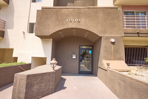 The entrance to a building with the number 1809 on it.