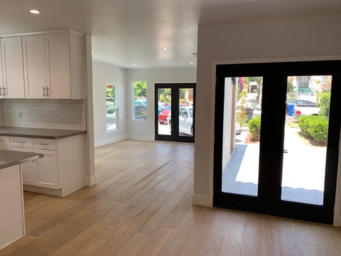 a view from the kitchen into the living room