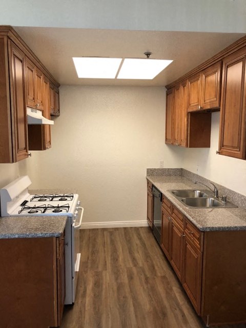 a kitchen with a stove and a sink