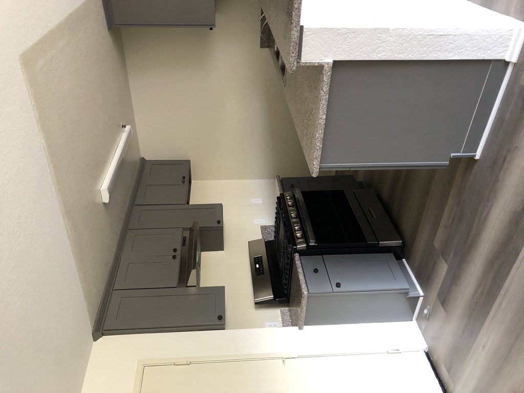 a view from the top of a staircase of a room with a printer and a