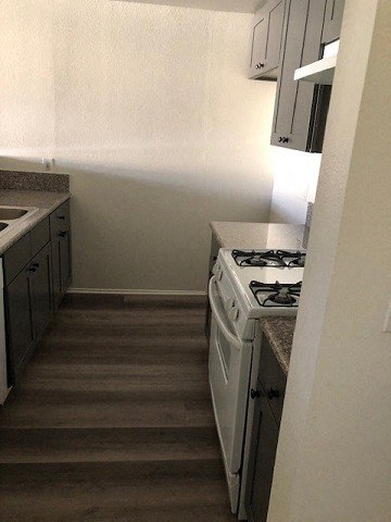 a small kitchen with a stove and a sink