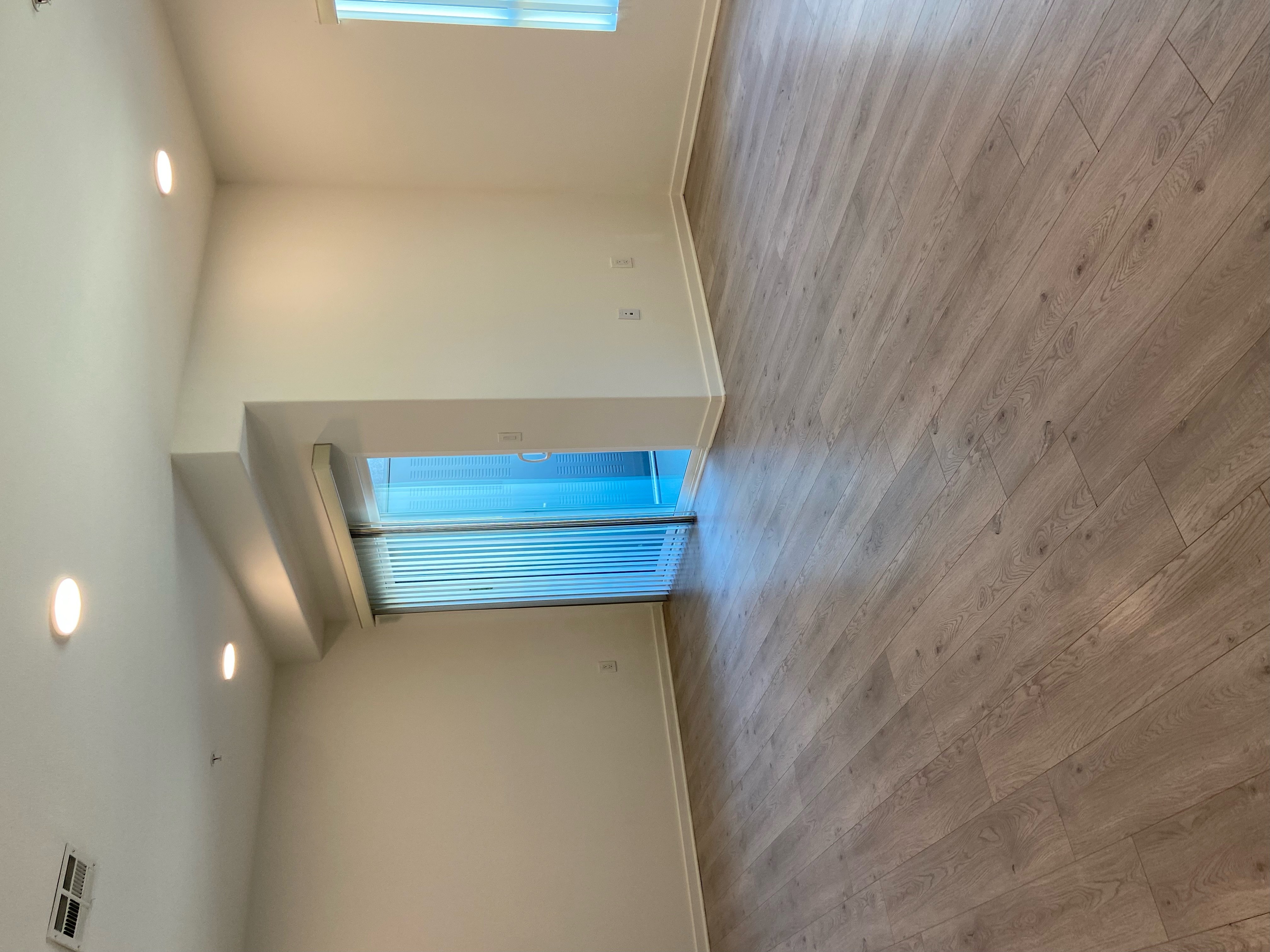 A room with a wooden ceiling and a skylight.