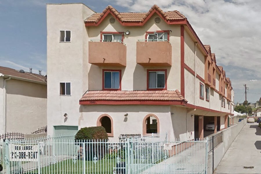 a building with a fence in front of it