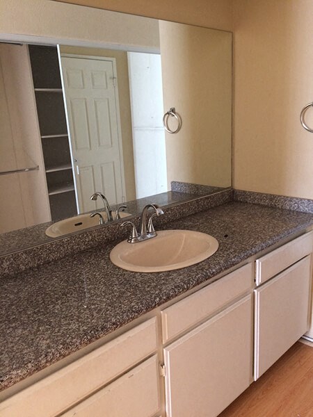 a bathroom with a sink and a mirror