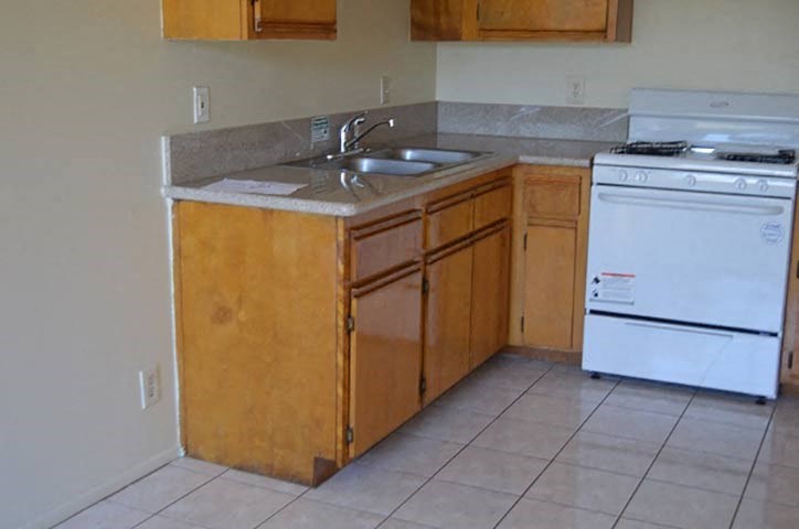 a kitchen with a sink and a stove