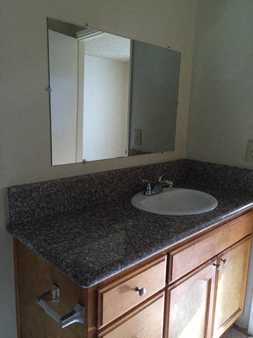 a bathroom with a sink and a mirror