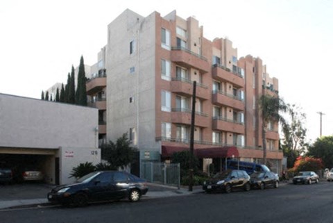 a building with cars parked in front of it